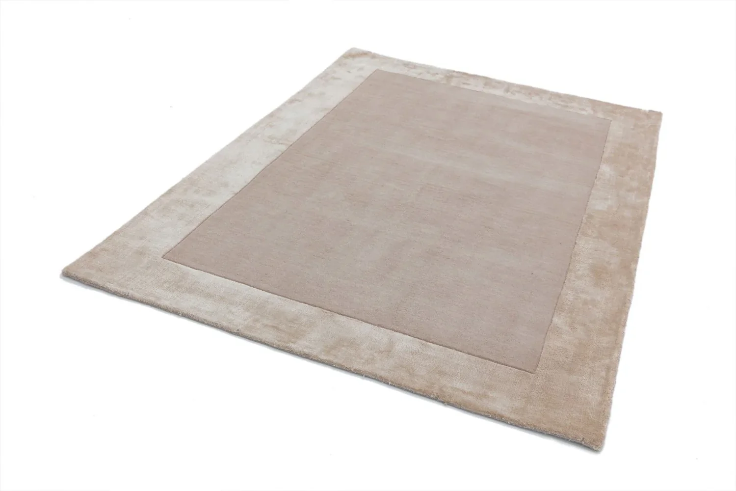 hand tufted carpet with elegant border design and soft plush texture."