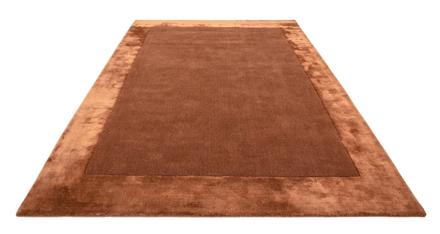 "Beige hand tufted carpet with elegant border design and soft plush texture."