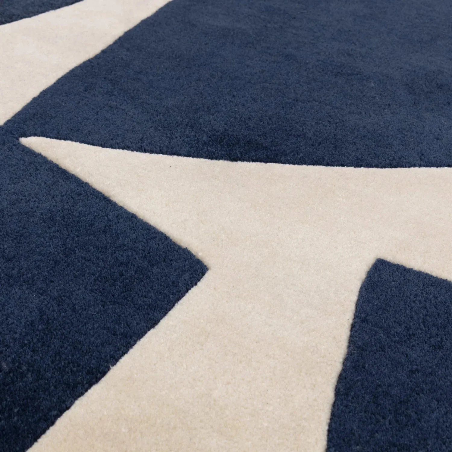 Tufted 15.4 hand tufted carpet with elegant border design and soft plush texture."