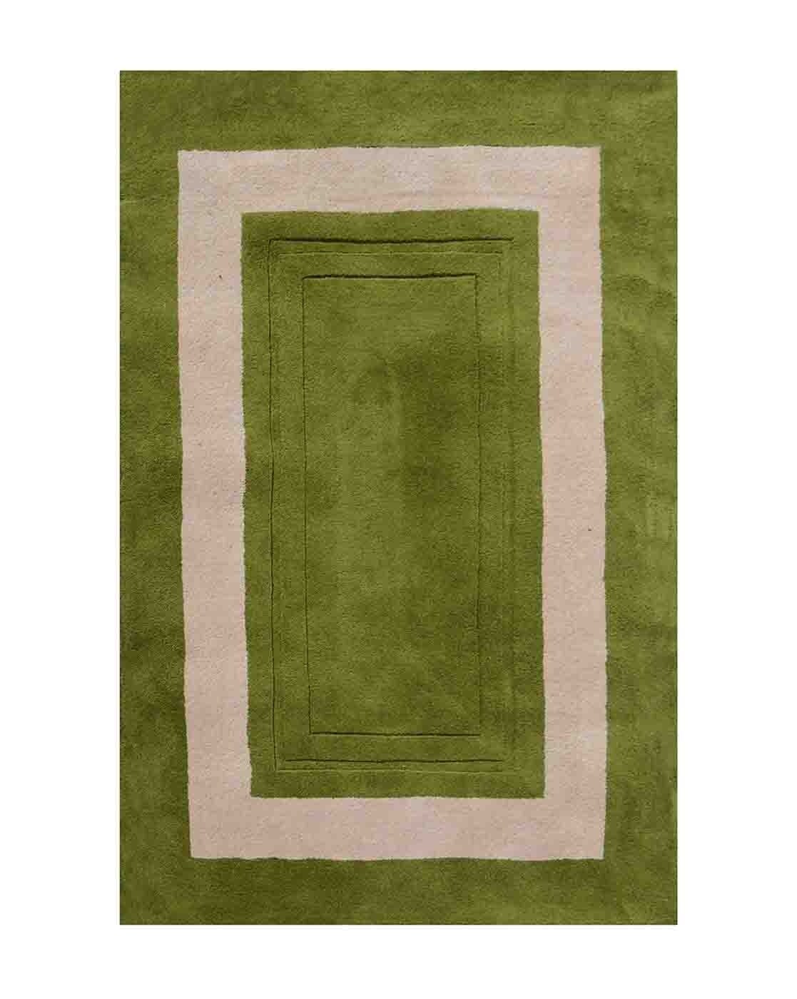 Tufted 37.2 hand tufted carpet with elegant border design and soft plush texture."