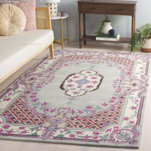 hand tufted carpet with elegant border design and soft plush texture."